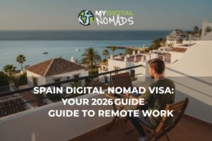 A digital nomad works on a laptop overlooking the Spanish coast, enjoying the Spain Digital Nomad Visa.